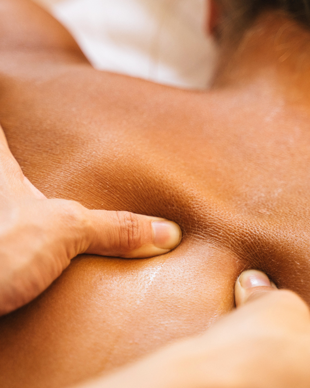Hot stone body massage at Viva Wellness Cambridge